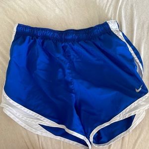 Blue Nike running shorts